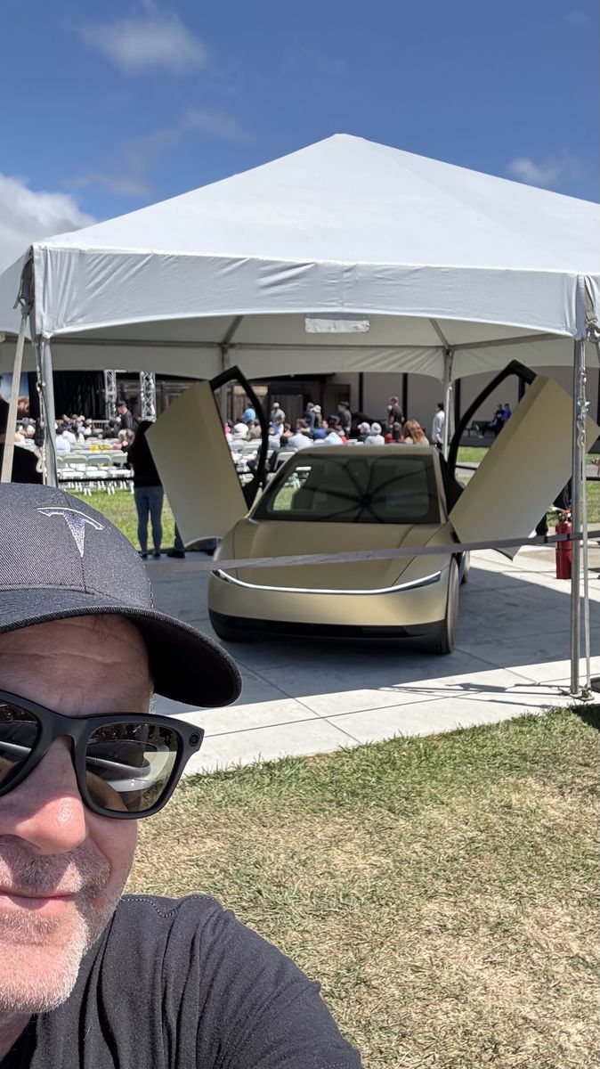 Bruce with a Cybercab at Tesla Takeover 2025, California